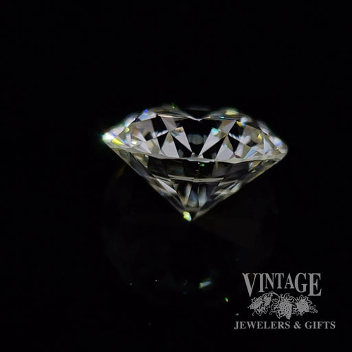 1.29 carat, round brilliant, M color, SI1 clarity, natural diamond side