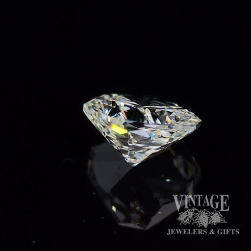 1.27 carat, radiant cut, L color, VS2 clarity, natural diamond side
