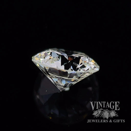 .73 carat, round brilliant, I color, SI1 clarity, natural diamond side