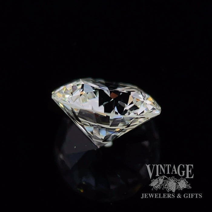 .73 carat, round brilliant, I color, SI1 clarity, natural diamond side
