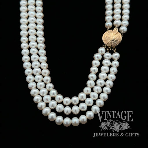 Triple strand pearl necklace with 14ky gold clasp