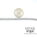 14 karat white gold 3.25 ct. total weight 7” natural diamond line bracelet, shown with quarter for size reference