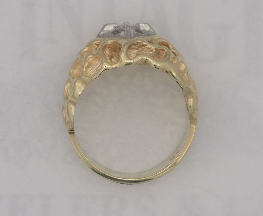 .18 carat yellow gold textured diamond ring.