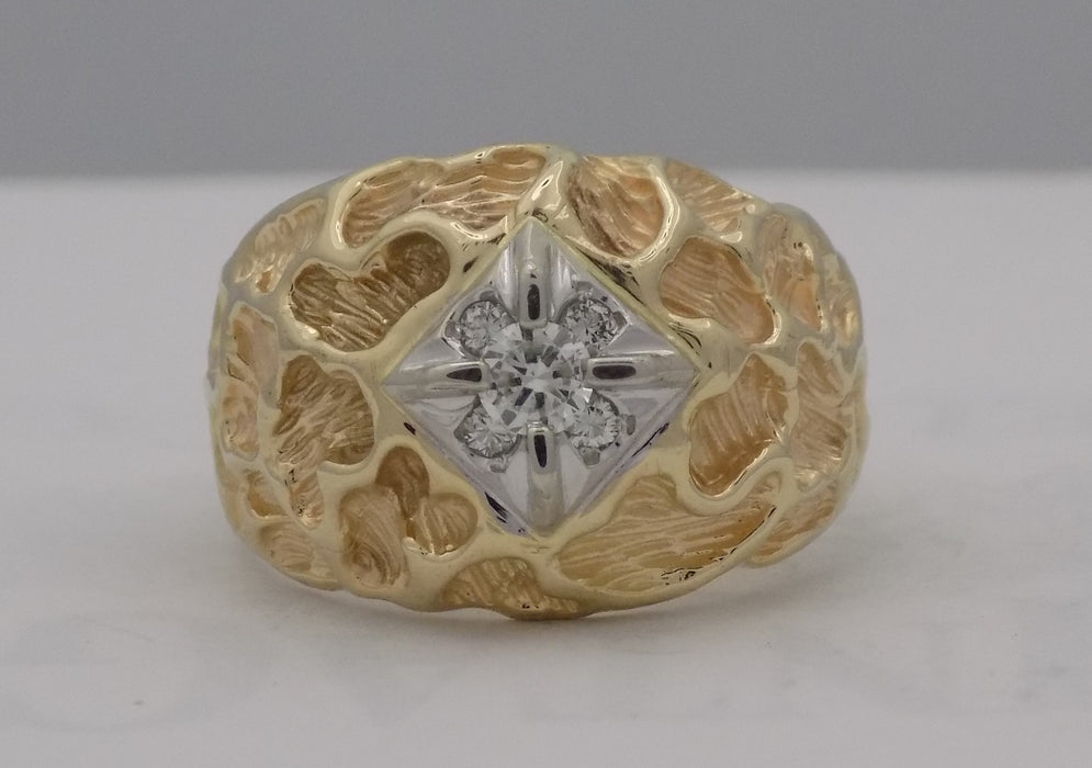 .18 carat yellow gold textured diamond ring.