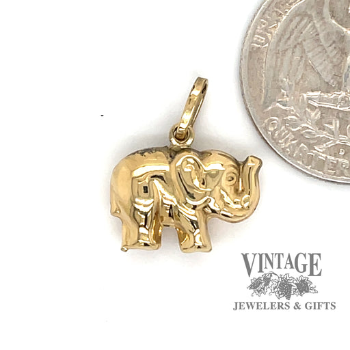 Elephant charm in 18ky gold quarter for scale