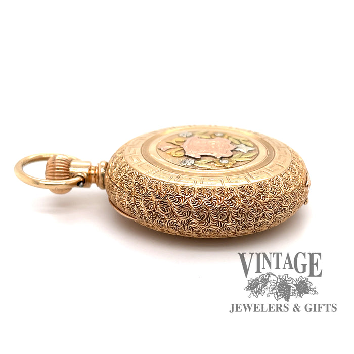 American Waltham Pocket watch in 14k multi color gold case, flat side view.