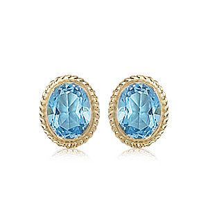 14 karat yellow gold oval Blue topaz bezel set twisted wire rim pierced stud earrings