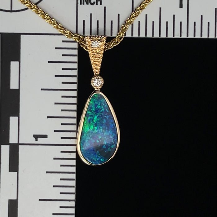 Black opal and diamond 14k gold pendant scale