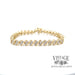 Twisting diamond tennis 14ky gold bracelet