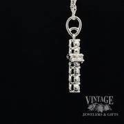 Diamond and 14kw gold “bubble” style cross necklace side