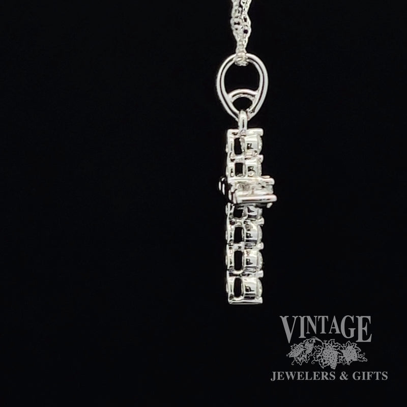 Diamond and 14kw gold “bubble” style cross necklace side