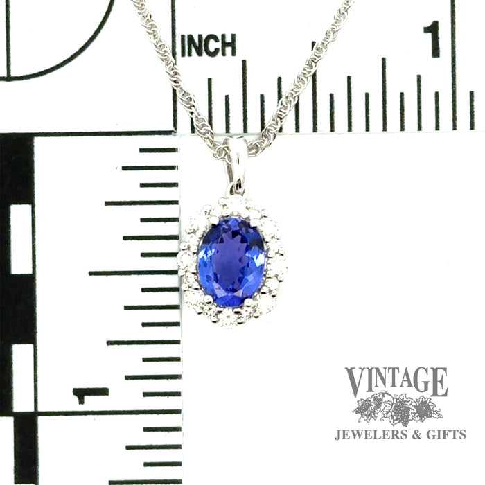 Oval tanzanite and diamond 14kw gold necklace scale