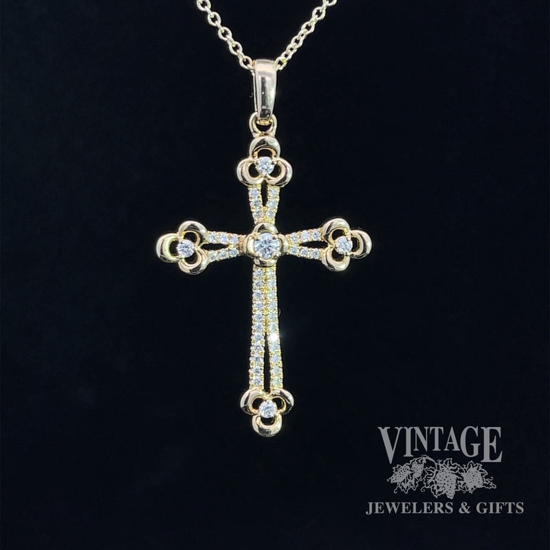Diamond and 14ky gold cross necklace.