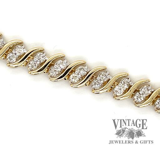 Twisting diamond tennis 14ky gold bracelet close