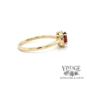 Oval garnet and diamond 14ky gold halo ring side