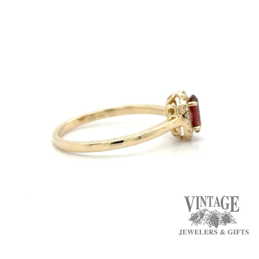 Oval garnet and diamond 14ky gold halo ring side