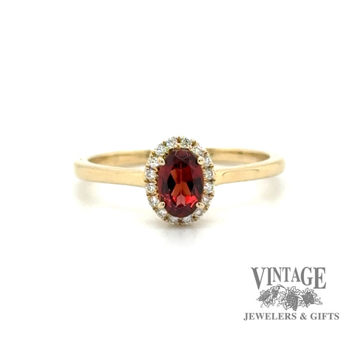 Oval garnet and diamond 14ky gold halo ring