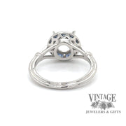 Diamond and caliber cut sapphire halo platinum ring bottom