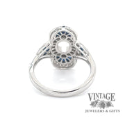 Elongated oval diamond and caliber cut sappire 14kw gold ring bottom