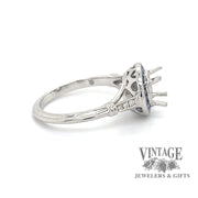 Diamond and caliber cut sapphire halo platinum ring side