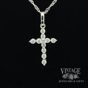 Diamond and 14kw gold “bubble” style cross necklace