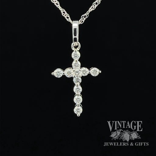 Diamond and 14kw gold “bubble” style cross necklace