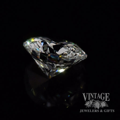 .88 carat, round brilliant, D color, I1 clarity, natural diamond side