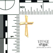 Modern 14 karat yellow gold and diamond estate cross with scale