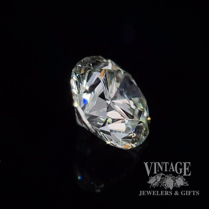 .90 carat, J color, SI2 clarity, Round brilliant, natural diamond.