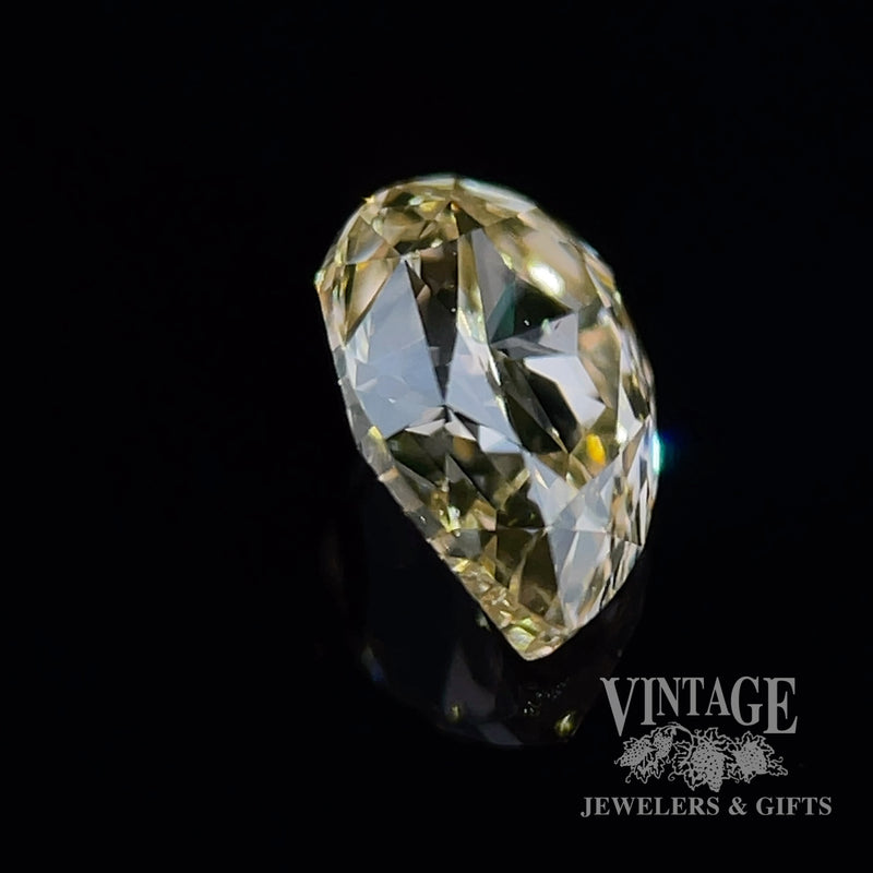 1.03 carat, pear shape, SI1 clarity, fancy yellow/brown, natural diamond