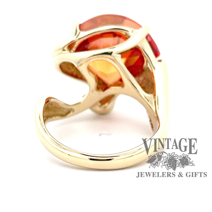 14 karat yellow gold freeform, fancy cut, fan-shaped, lab-created orange Padparadscha sapphire ring, underside