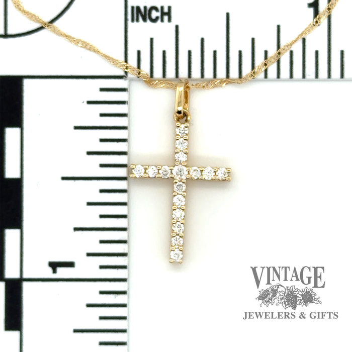 Diamond cross necklace in 14k yellow gold scale