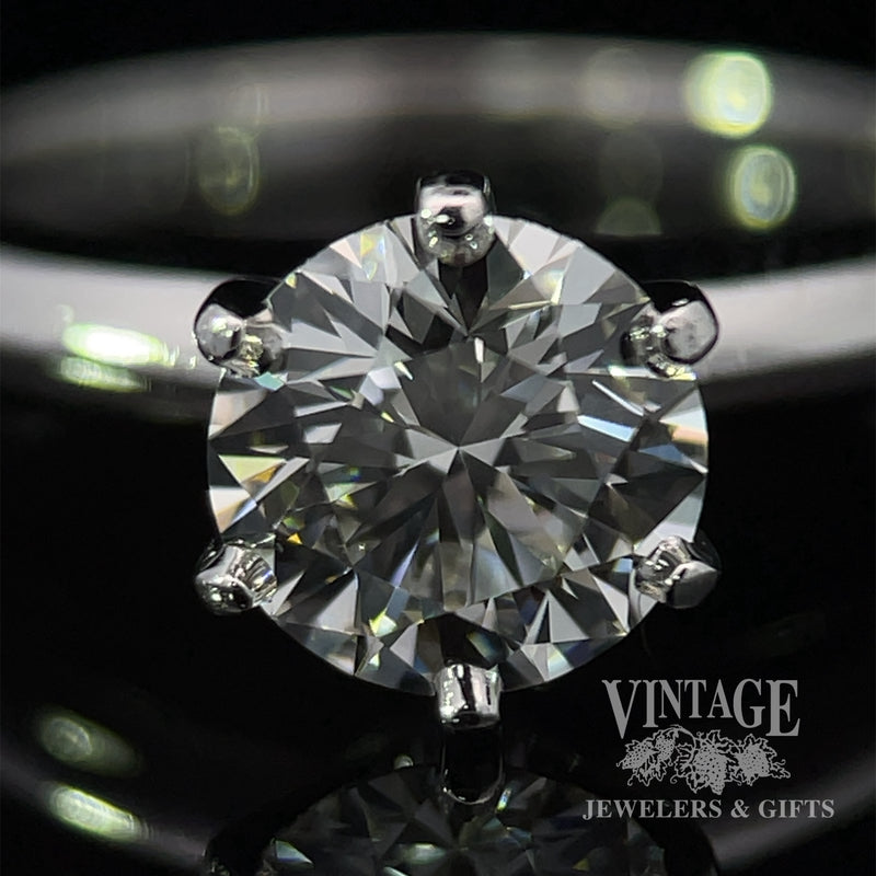 Estate Tiffany and Company platinum and diamond solitaire ring close up.