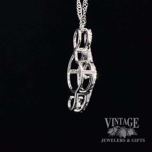 Music note 14 karat white gold and diamond necklace side