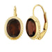 14 karat yellow gold oval garnet lever back pierced drop earrings with twist bezel