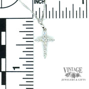 Diamond and 14kw gold “bubble” style cross necklace scale