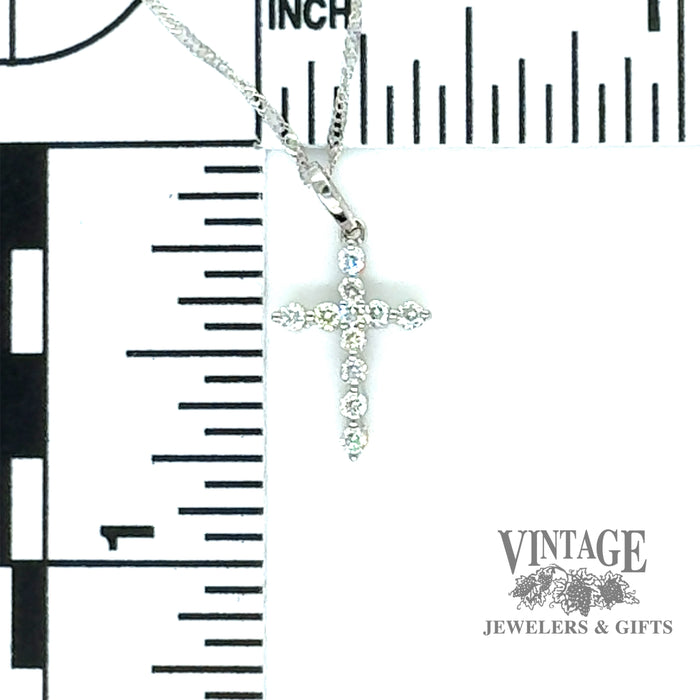 Diamond and 14kw gold “bubble” style cross necklace scale