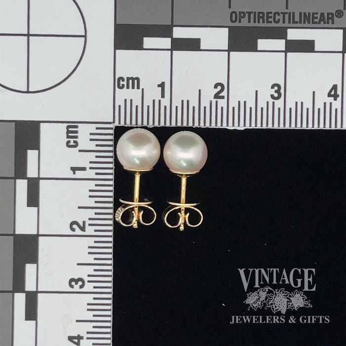 7.7 mm white/rose 18k gold akoya pearl stud earrings. scale
