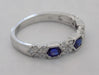 14kw gold .74ct Sapphire and diamond band ring, angled view