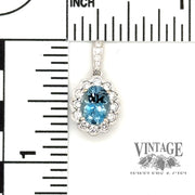 Aquamarine and diamond oval 18kw gold pendant scale