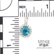 3.87 ct. natural blue zircon and diamond 18kw gold pendant scale
