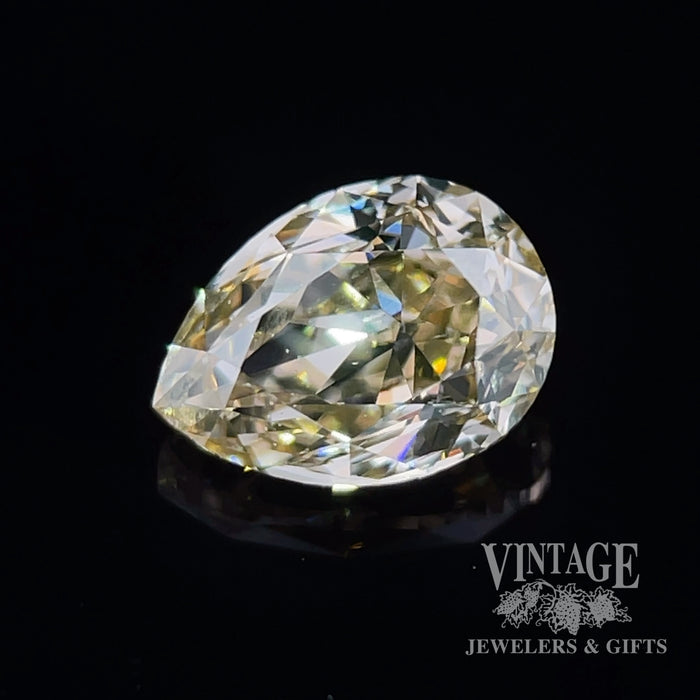 1.03 carat, pear shape, SI1 clarity, fancy yellow/brown, natural diamond