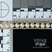 Vintage 14 karat yellow gold cultured pearl and rope chain bracelet, with size scale