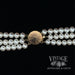 Triple strand pearl necklace with 14ky gold clasp clasp