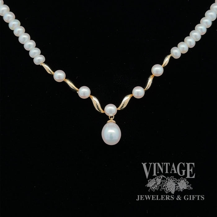 Fresh water cultured pearl drop necklace with 14 karat yellow gold centerpiece
