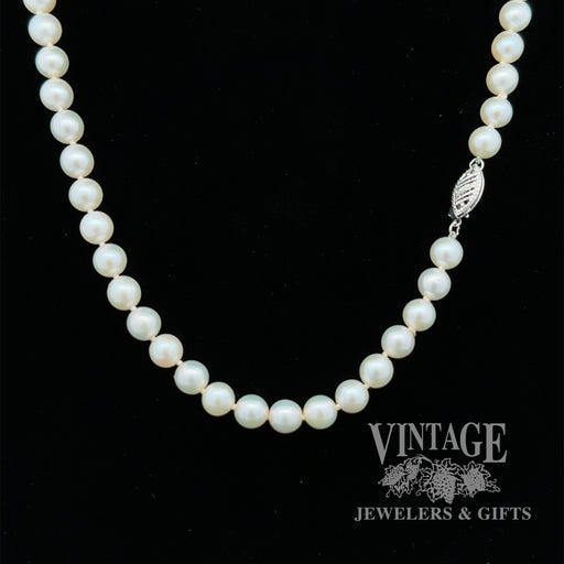 19” white 6.3 mm pearl strand with 14kw gold clasp