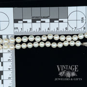 19” white 6.3 mm pearl strand with 14kw gold clasp scale