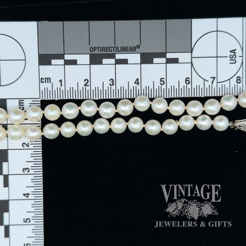 19” white 6.3 mm pearl strand with 14kw gold clasp scale