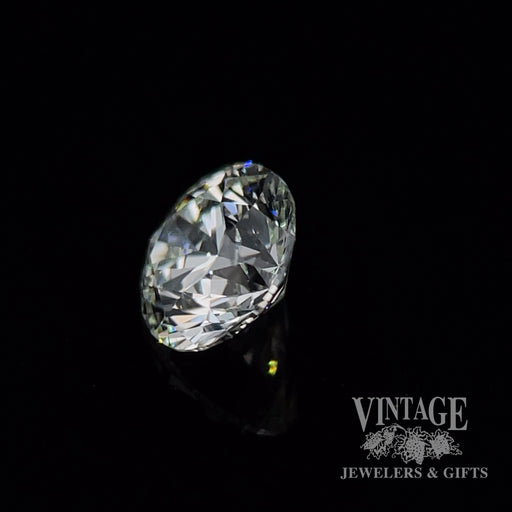 .66 carat, round brilliant, H color, SI2 clarity, natural diamond side