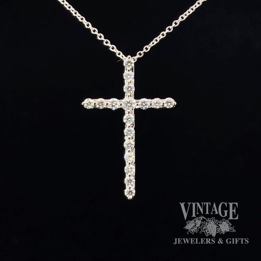 Diamond and 14k white gold cross necklace.